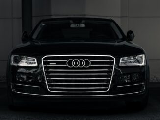 a black and white photo of an audi car